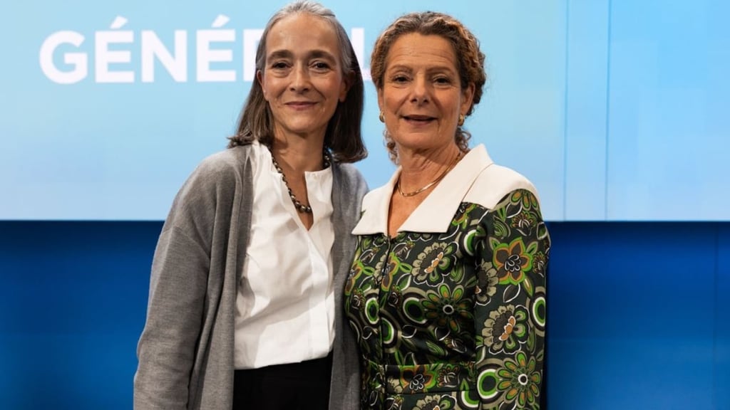 This is a photo of France Télévisions CEO Delphine Ernotte Cunci and Swedish Radio Director General Cilla Benkö standing closely together posed for a photograph. Delphine is on the left and Cilla is on the right. 