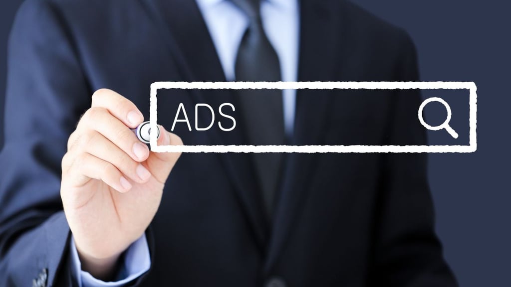Businessman writing "ads" on a board