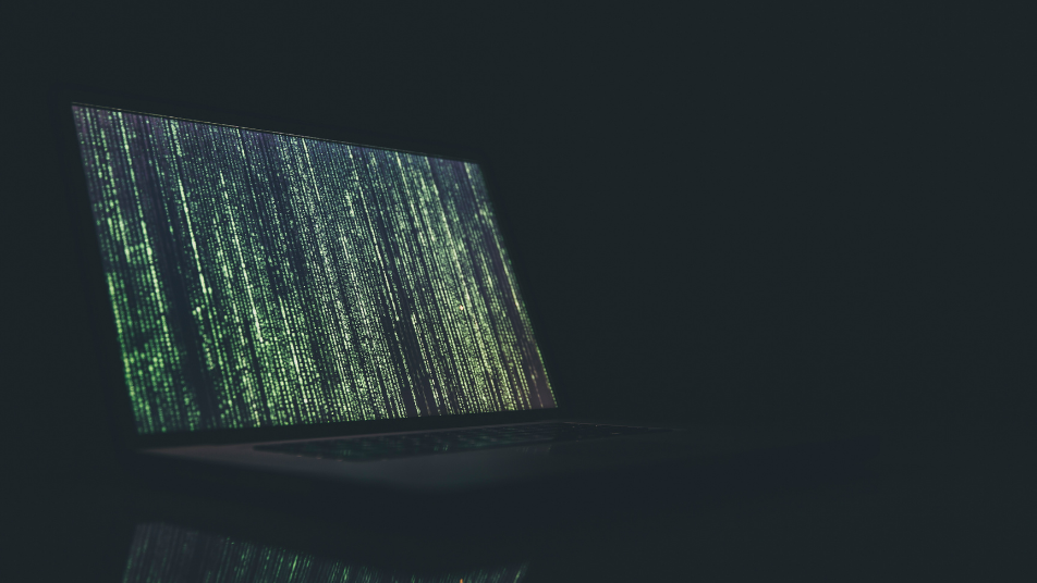 Shadowy photo of a computer coding