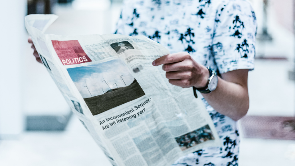 Person reading a newspaper